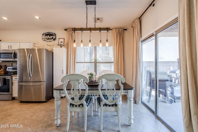 1145 E Lowell Ave, Gilbert, AZ 85295 - dining area with light tile patterned floors and recessed lighting