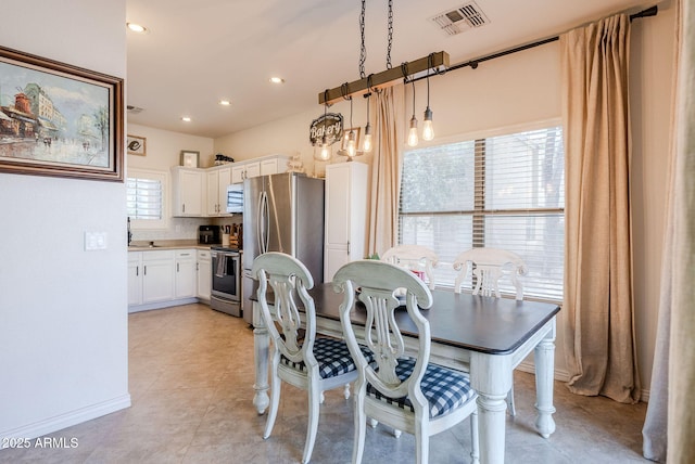 1145 E Lowell Ave, Gilbert, AZ 85295 - dining space with light tile patterned floors and recessed lighting