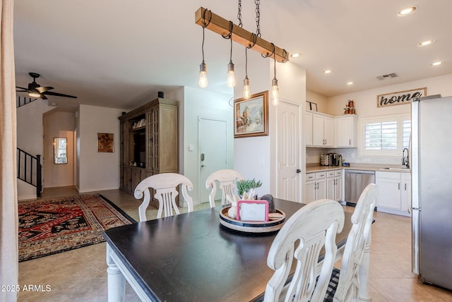 1145 E Lowell Ave, Gilbert, AZ 85295 - dining room featuring ceiling fan, recessed lighting, and stairs