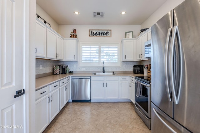 1145 E Lowell Ave, Gilbert, AZ 85295 - kitchen featuring appliances with stainless steel finishes, a sink, tasteful backsplash, light countertops, and recessed lighting