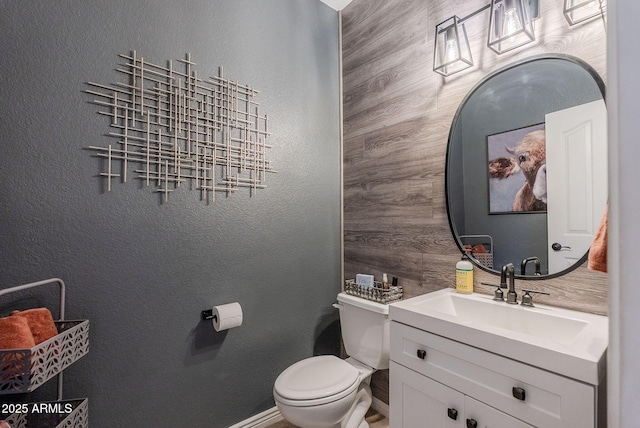 1145 E Lowell Ave, Gilbert, AZ 85295 - half bathroom featuring toilet, vanity, baseboards, and a textured wall