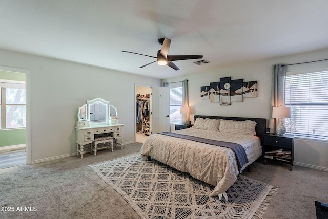 1145 E Lowell Ave, Gilbert, AZ 85295 - carpeted bedroom featuring a walk in closet, a closet, baseboards, and ceiling fan