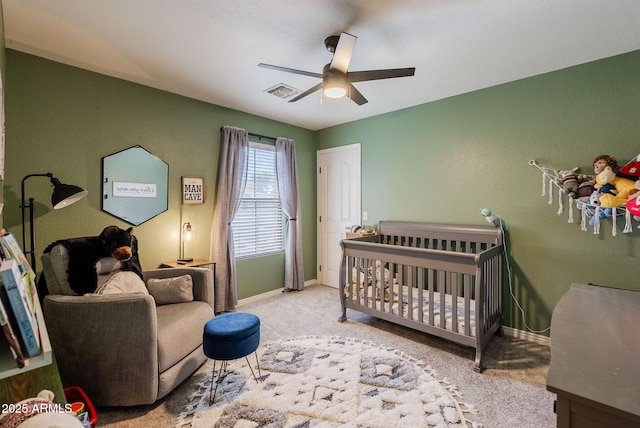 1145 E Lowell Ave, Gilbert, AZ 85295 - carpeted bedroom with a crib, baseboards, and a ceiling fan