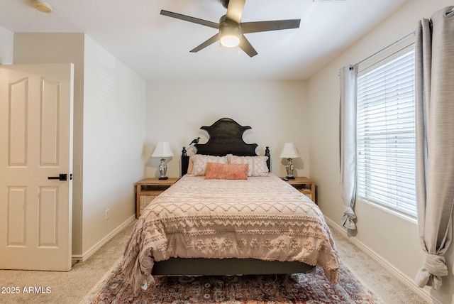1145 E Lowell Ave, Gilbert, AZ 85295 - bedroom with light colored carpet, multiple windows, ceiling fan, and baseboards