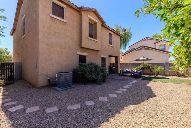 1145 E Lowell Ave, Gilbert, AZ 85295 - back of property featuring stucco siding, central AC, a fenced backyard, a patio area, and a tiled roof