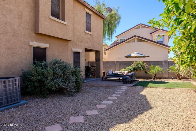 1145 E Lowell Ave, Gilbert, AZ 85295 - rear view of house with cooling unit, stucco siding, an outdoor hangout area, and a fenced backyard