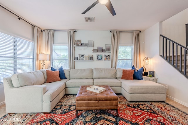 1145 E Lowell Ave, Gilbert, AZ 85295 - living room featuring ceiling fan, stairs, and baseboards
