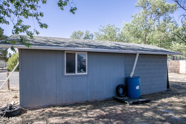 view of property exterior featuring a storage shed