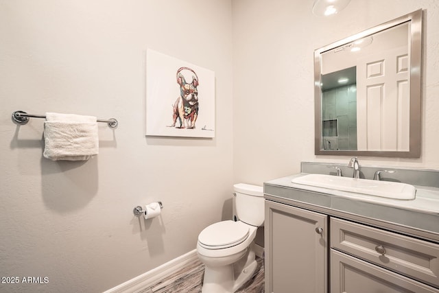 12448 N 129th Pl, Scottsdale, AZ 85259 - half bath featuring toilet, vanity, wood finished floors, and baseboards