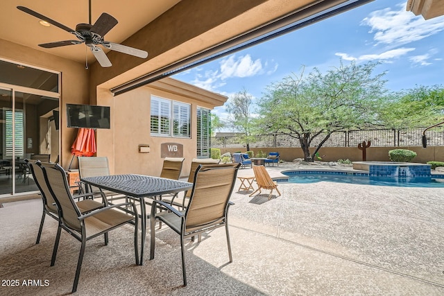 12448 N 129th Pl, Scottsdale, AZ 85259 - fenced backyard featuring a ceiling fan, a patio, outdoor dining space, and a pool with connected hot tub