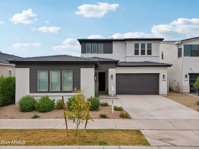 prairie-style home featuring a garage