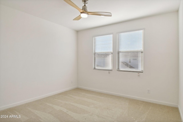 carpeted empty room with ceiling fan