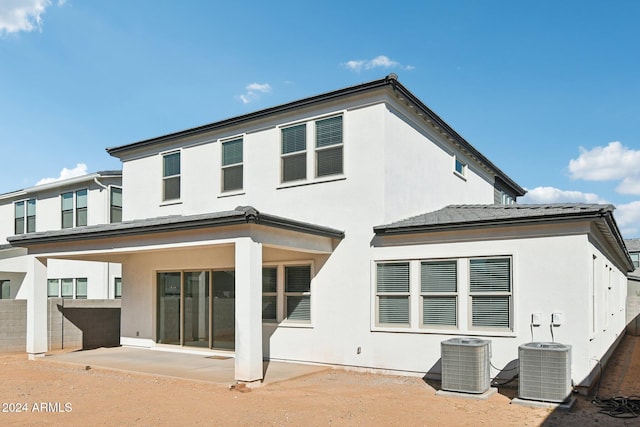 back of house featuring central AC unit and a patio area