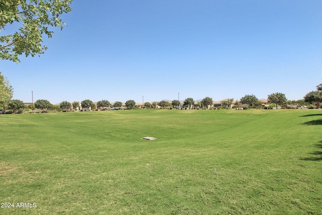 view of home's community featuring a lawn