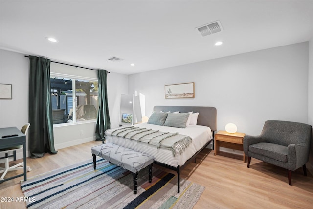 bedroom with light hardwood / wood-style flooring