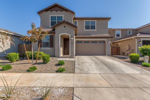 mediterranean / spanish-style home with a garage