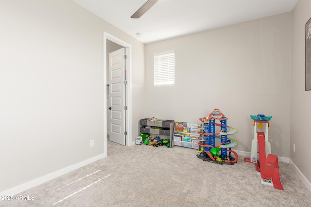 game room with carpet and ceiling fan