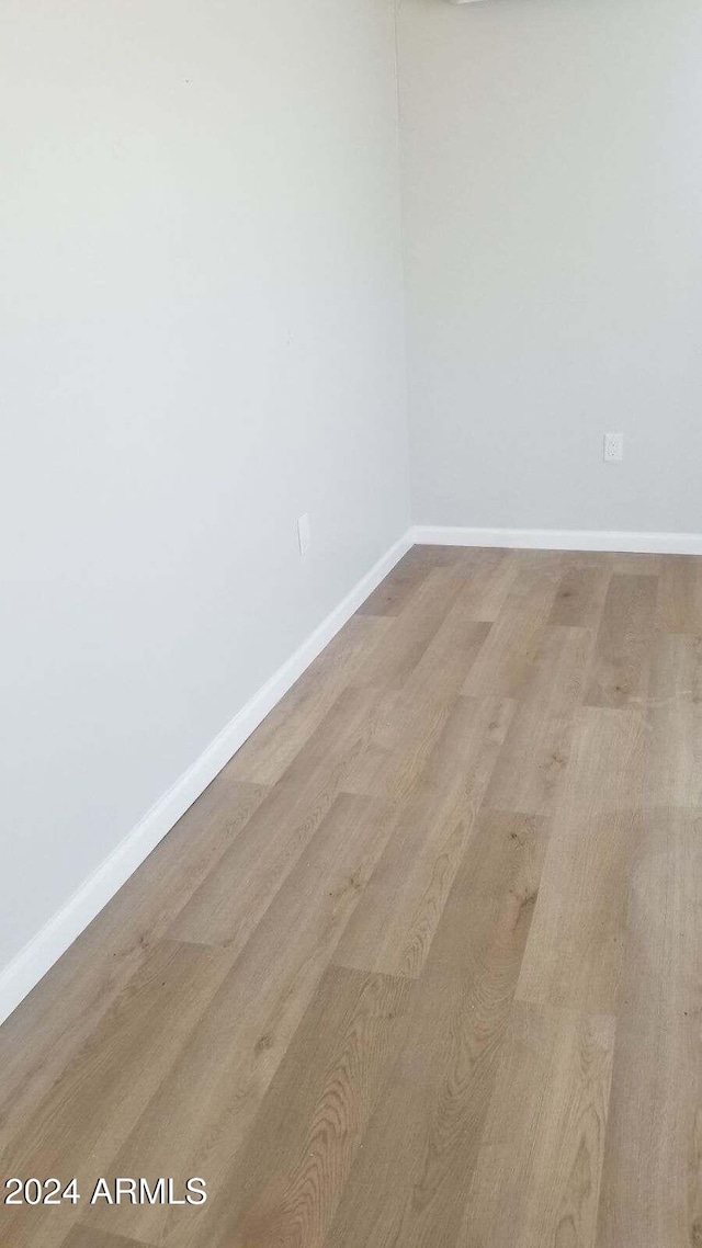 spare room featuring light hardwood / wood-style flooring