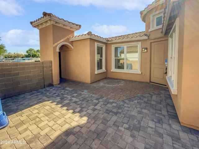 view of patio / terrace featuring fence