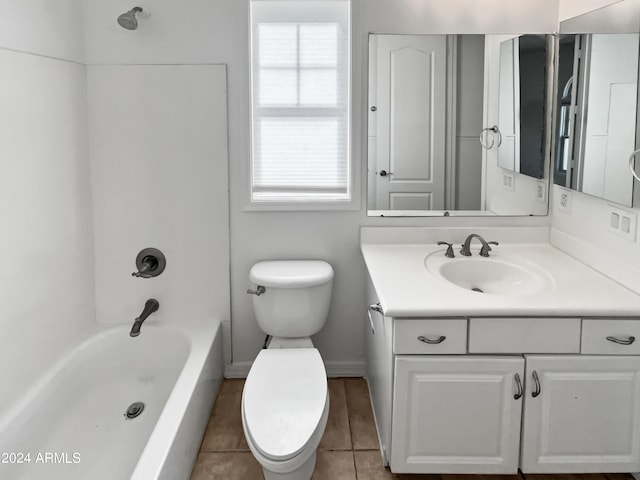 bathroom with bathtub / shower combination, baseboards, vanity, and toilet