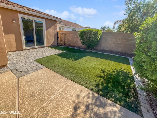 view of yard featuring a patio and fence