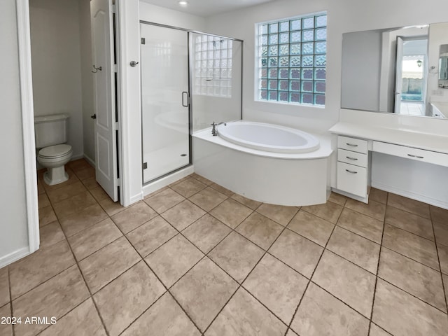 full bath featuring a stall shower, toilet, and tile patterned floors