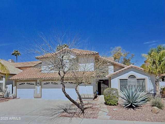 view of front facade featuring stucco siding, a tile roof, concrete driveway, an attached garage, and a chimney