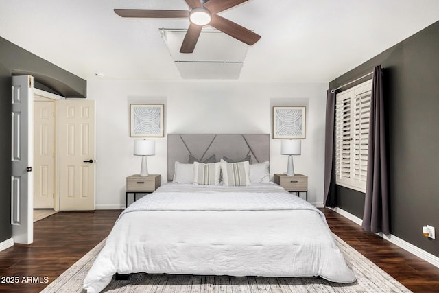 bedroom featuring dark wood finished floors, baseboards, and ceiling fan