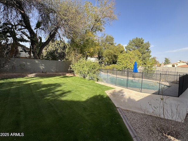 view of yard featuring a fenced in pool, a patio, and a fenced backyard