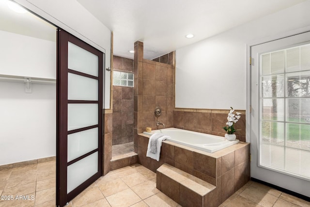 bathroom with a garden tub, recessed lighting, tile patterned floors, and walk in shower