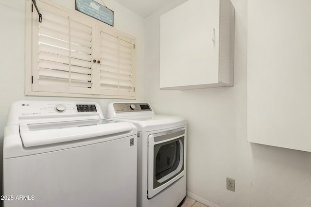 laundry area featuring cabinet space and washing machine and dryer