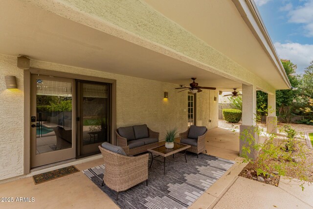 view of patio / terrace with an outdoor living space and a ceiling fan