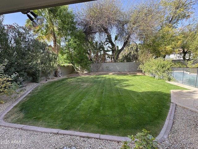 view of yard with a fenced backyard