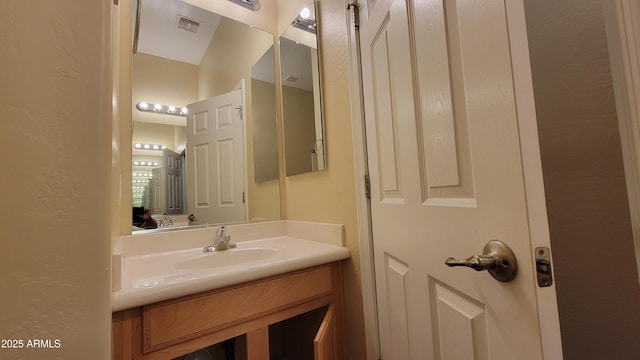 bathroom featuring vanity and visible vents