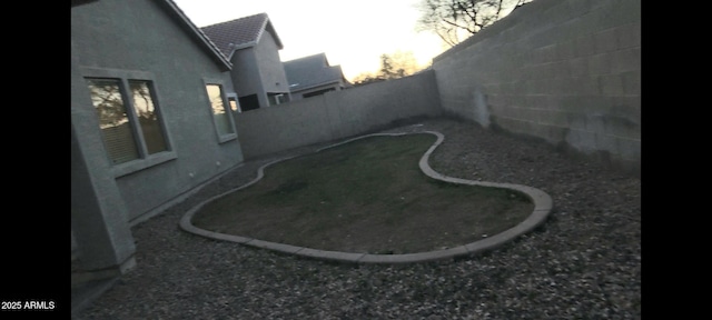 view of yard featuring a fenced backyard