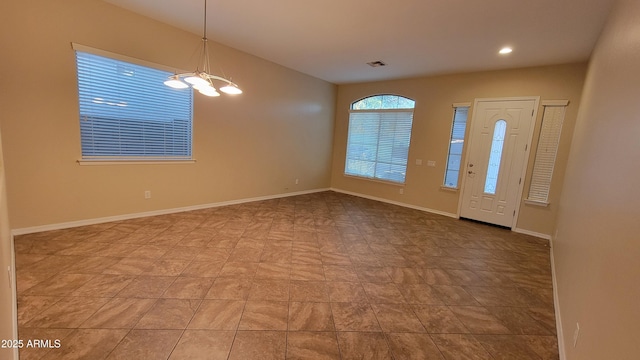 entryway featuring an inviting chandelier, baseboards, visible vents, and recessed lighting