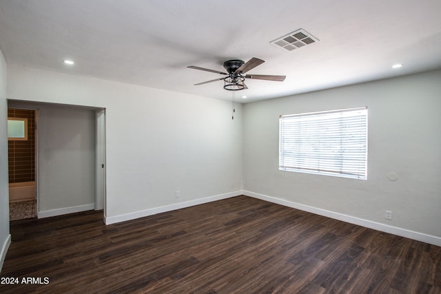 empty room featuring ceiling fan and dark hardwood / wood-style floors