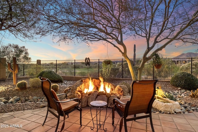 patio terrace at dusk with a fire pit