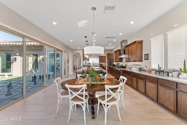 dining room featuring light tile patterned flooring