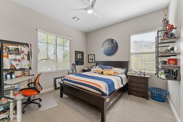 carpeted bedroom with ceiling fan