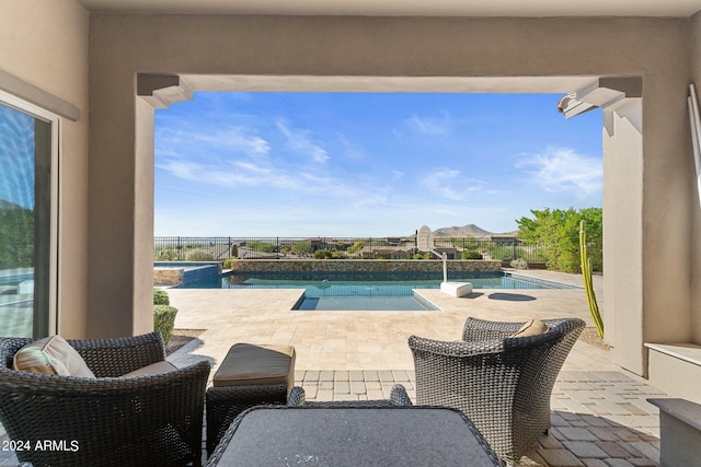 view of swimming pool with a patio area