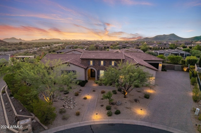 view of front of house featuring a mountain view and a garage