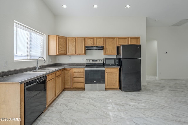 kitchen featuring black appliances, a towering ceiling, range hood, and sink