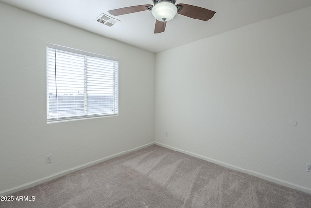 carpeted empty room with ceiling fan