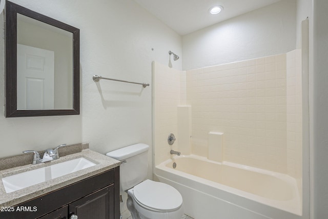 full bathroom featuring vanity, washtub / shower combination, and toilet