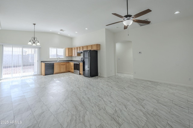 kitchen with black appliances, sink, pendant lighting, vaulted ceiling, and ceiling fan with notable chandelier