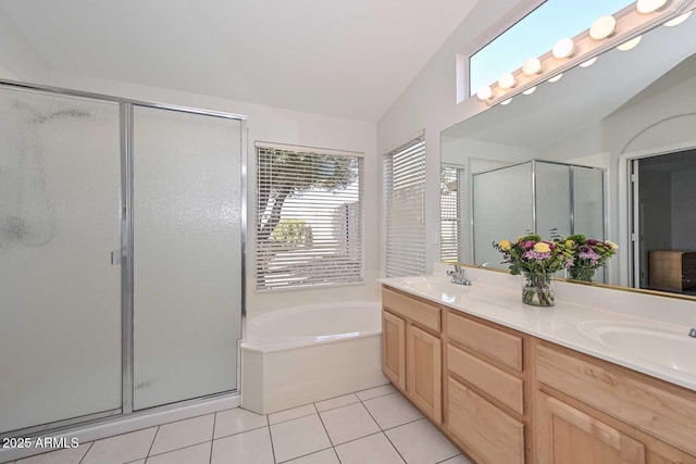 bathroom featuring vanity, tile patterned floors, and plus walk in shower