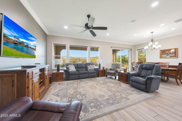 13236 W Montansoro Ln, Peoria, AZ 85383 - living area with a chandelier, a ceiling fan, light wood-type flooring, recessed lighting, and ornamental molding