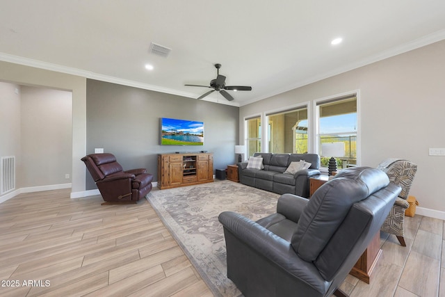 13236 W Montansoro Ln, Peoria, AZ 85383 - living area with crown molding, light wood finished floors, baseboards, ceiling fan, and recessed lighting
