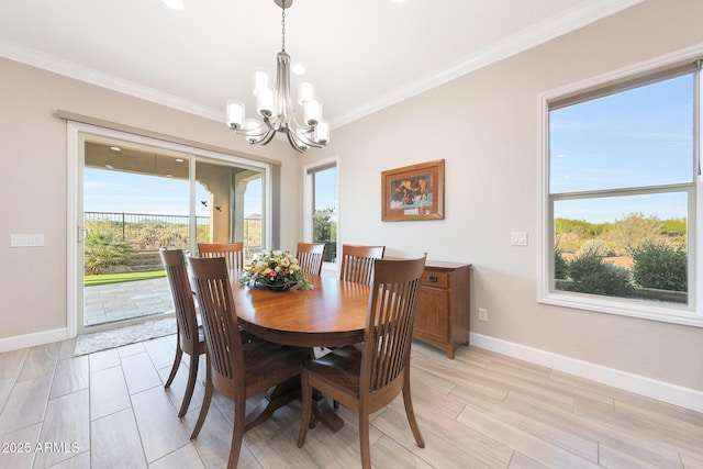 13236 W Montansoro Ln, Peoria, AZ 85383 - dining room featuring a chandelier, crown molding, baseboards, and light wood-style floors